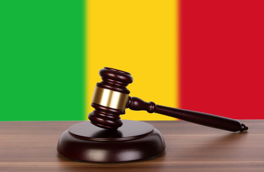 Wooden gavel and flag of Mali