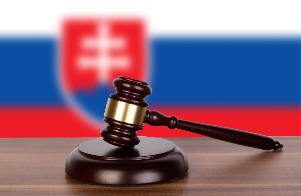 Wooden gavel and flag of Slovakia