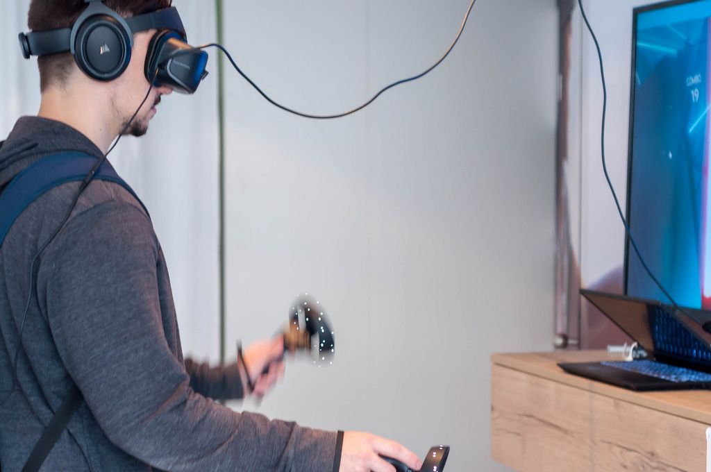 Young man using a Windows Mixed Reality headset