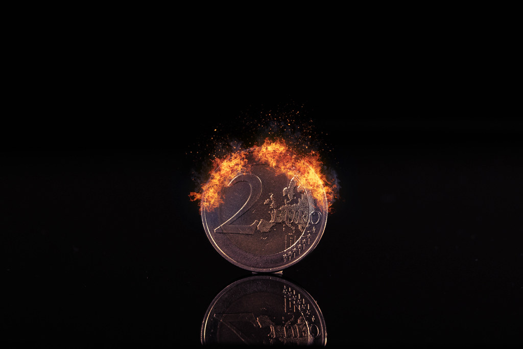 2 Euro coin burning in fire