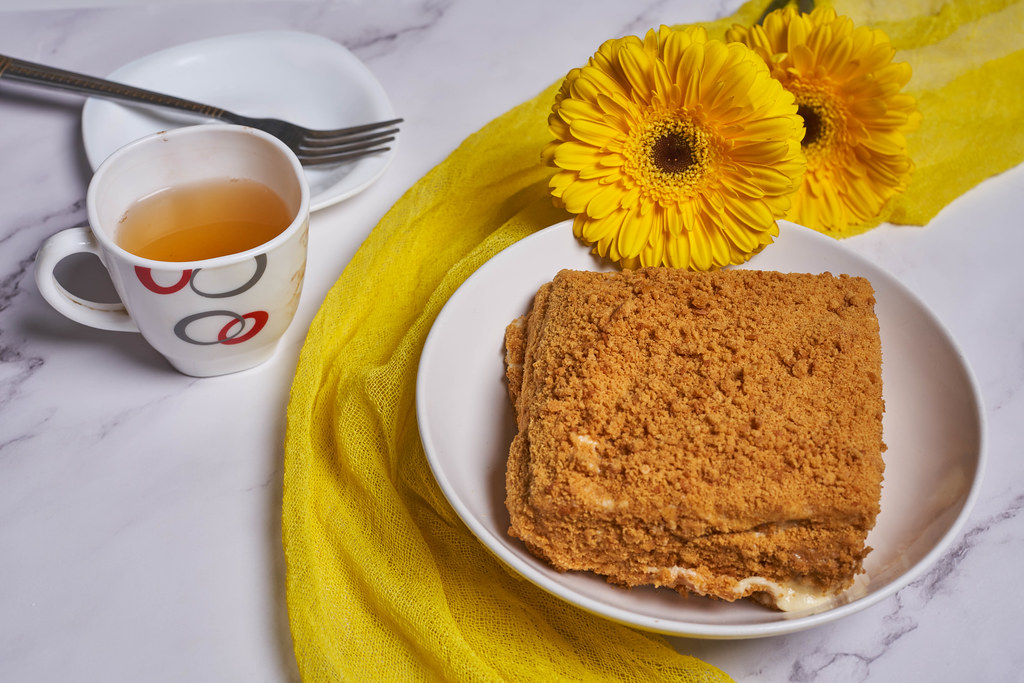 26. Sweet spring morning breakfast with slice of layered honey cake.jpg
