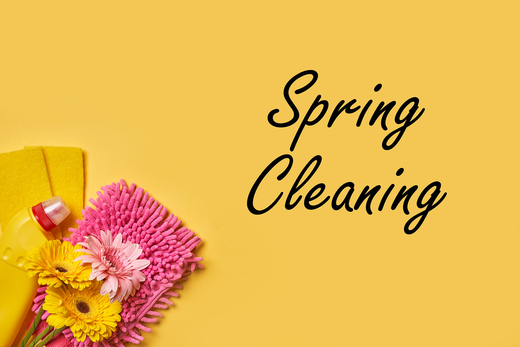 29. Supplies for spring cleaning on bright yellow background.jpg