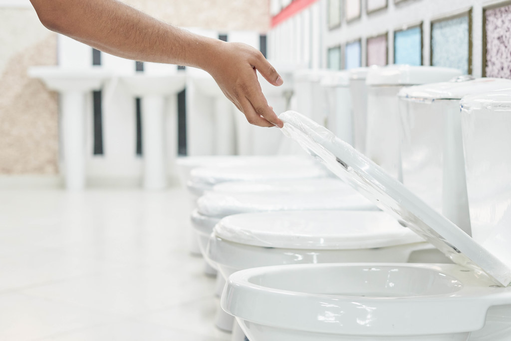 A customer checking and choosing a new toilet bowl