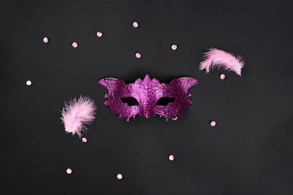 A purple mardi gras with feathers