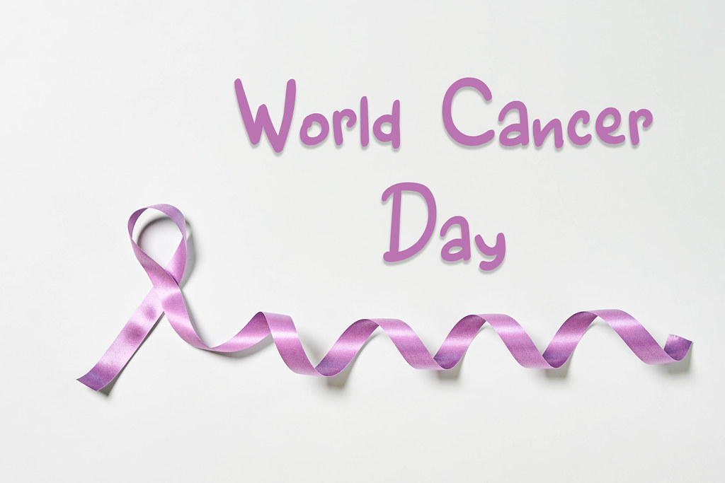 A purple ribbon - symbol of World Cancer day