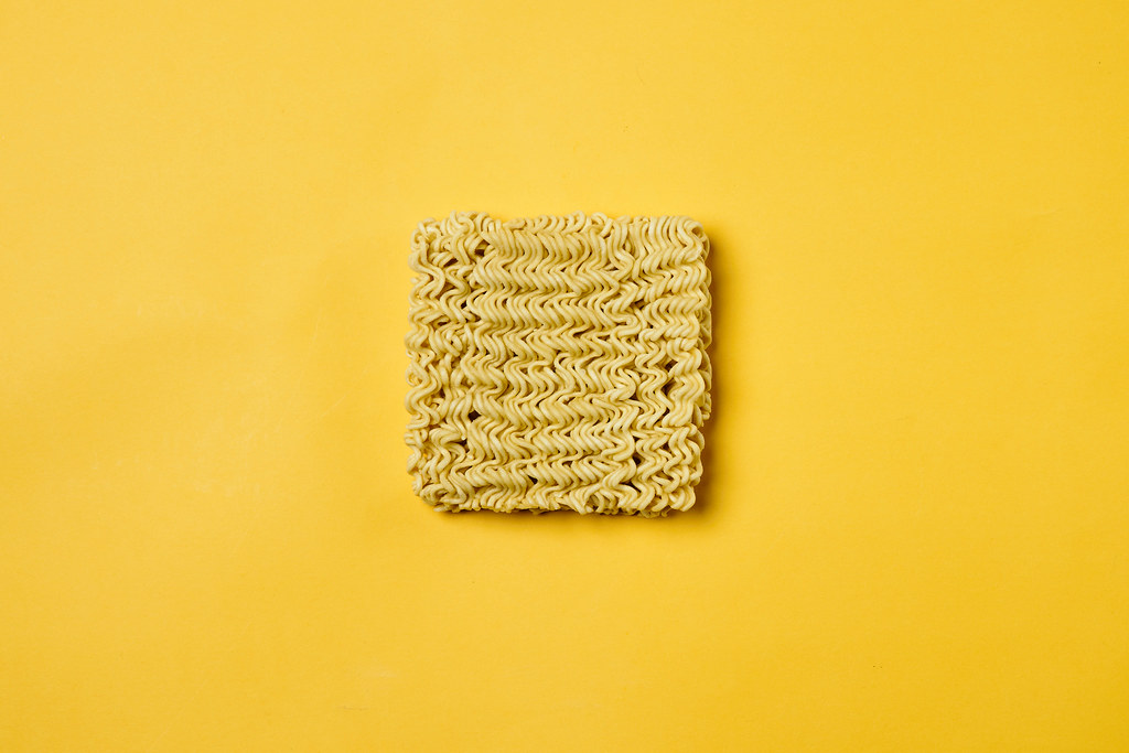 A quick cooking instant noodle on yellow
