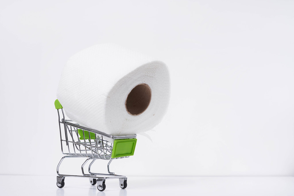 A roll of toilet paper in the shopping cart