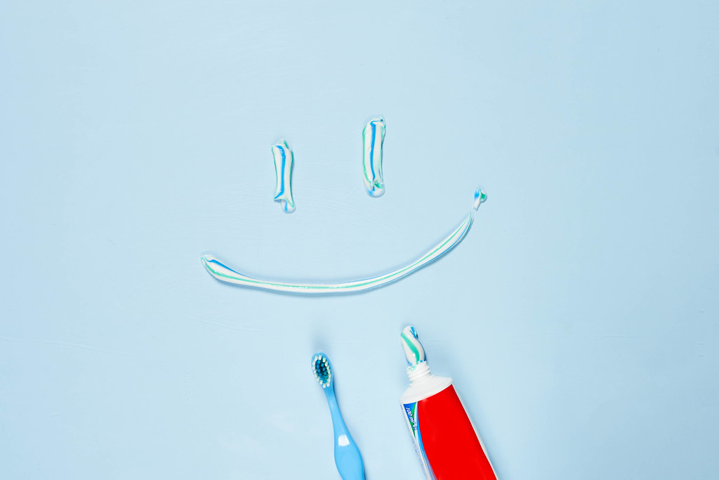A smile made with paste. Toothpaste and brush