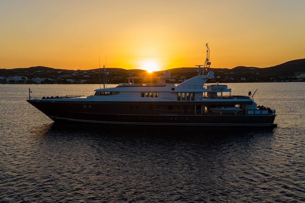 A yacht in the sunset light near the harbour of Adámas, Milos, South Aegean