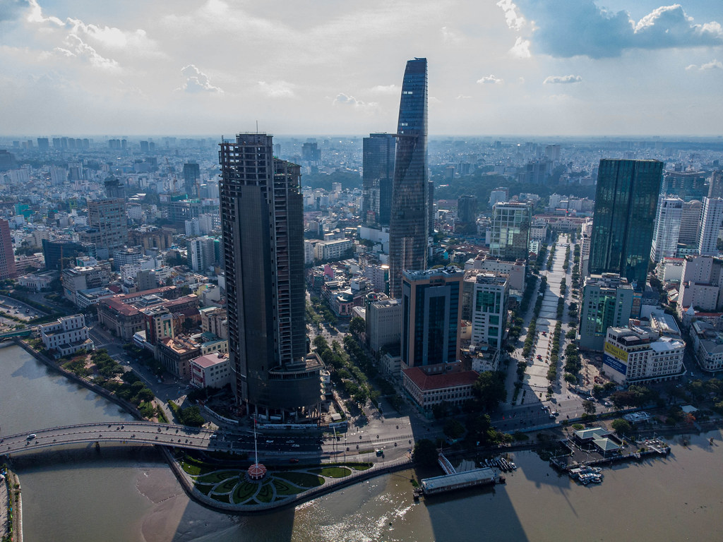 Aerial Drone Photo of Saigon Skyline with Nguyen Hue Walking Street, Thu Ngu Flagpole, Bitexco Financial Tower and Saigon One in Ho Chi Minh City, Vietnam