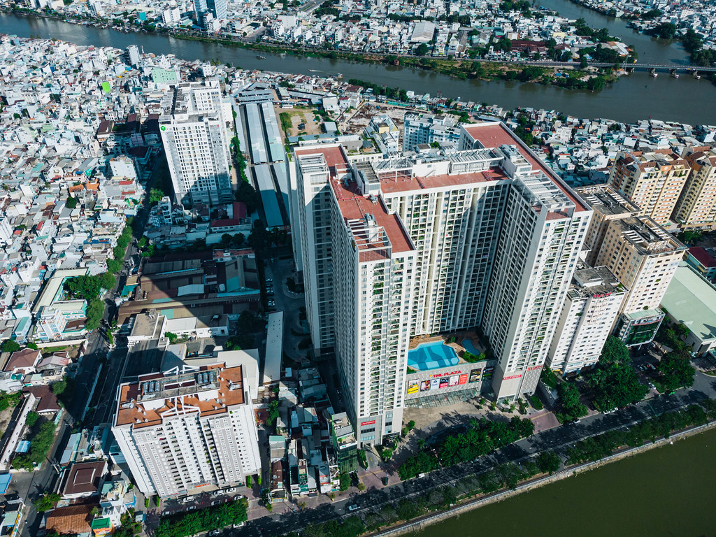 Aerial Drone Photo of The Gold View Apartment Building with Swimming Pool and Shopping Mall in District 4 of Ho Chi Minh City, Vietnam