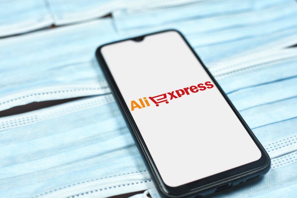 Aliexpress logo on mobile phone display. Impact of coronavirus on global business