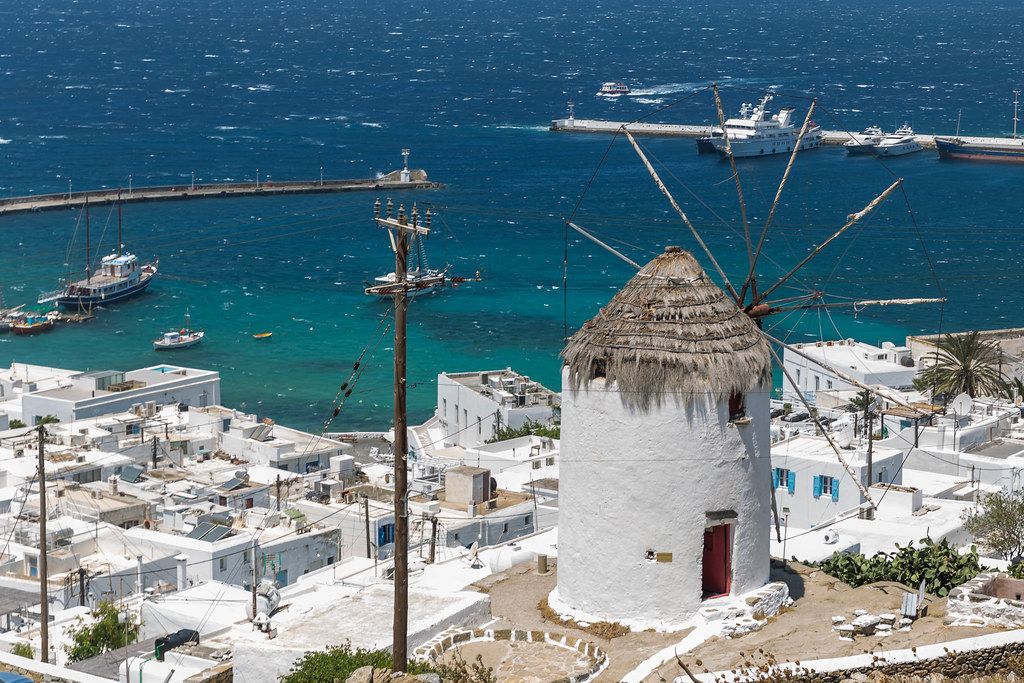 Ancient windmill, symbol of the Cyclades, overlooking Mykonos