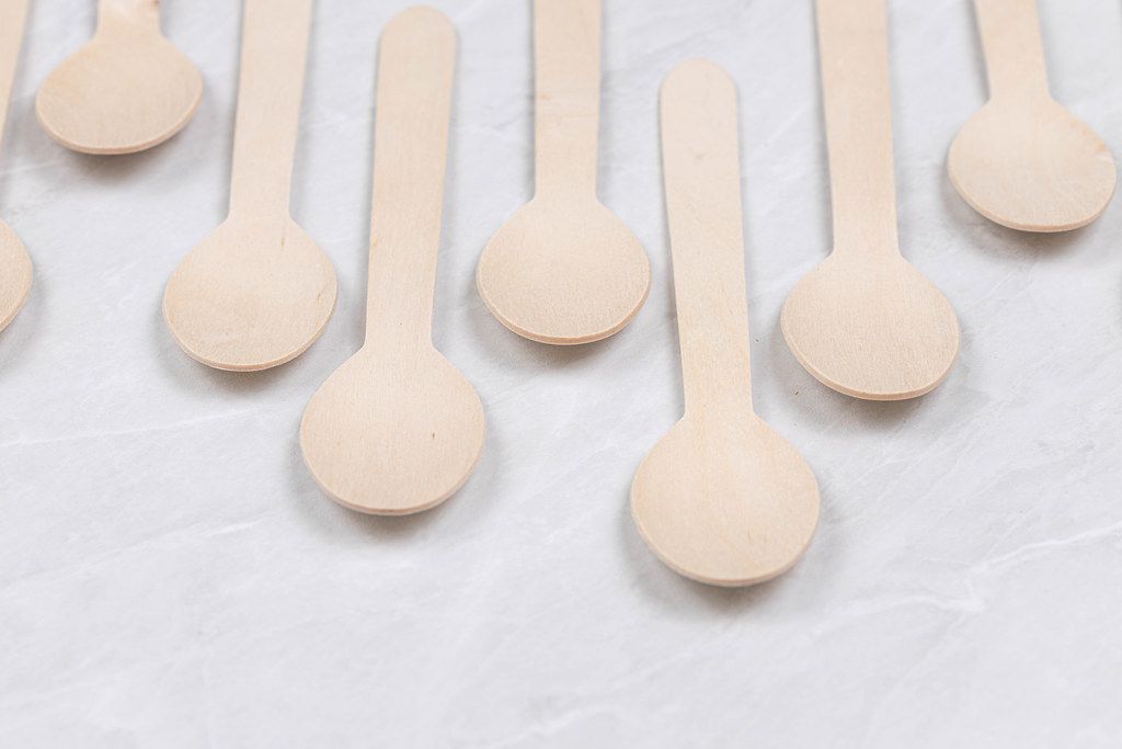 Arranged Wooden Spoons on the grey table