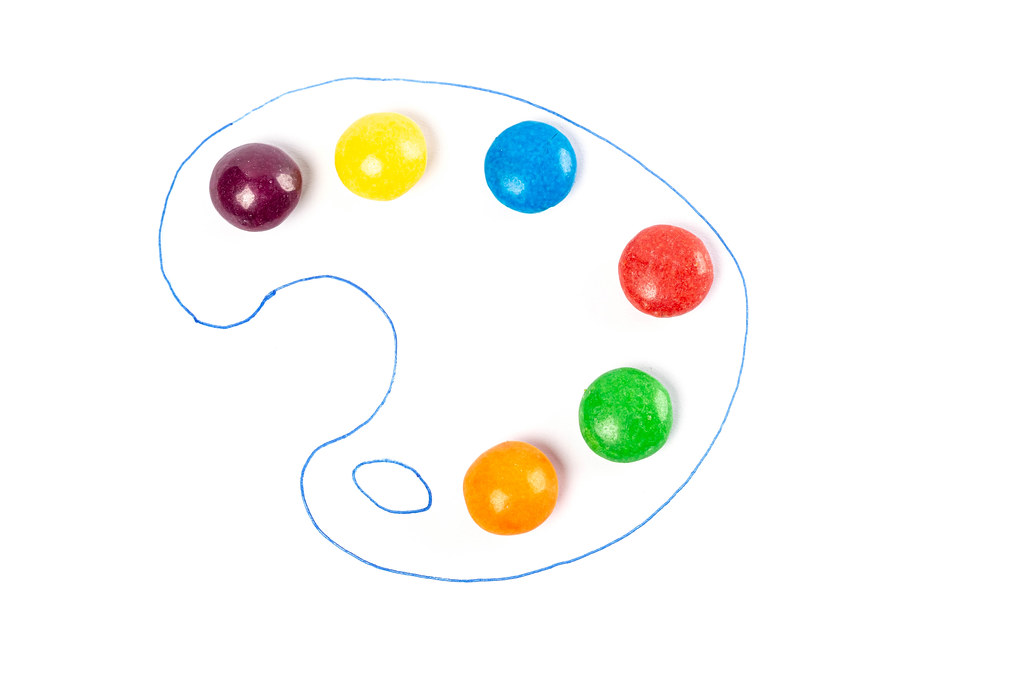 Art of sweetmeats concept, sweet candies in the drawn paint palette