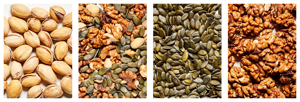 Assorted healthy food background - nuts and seeds