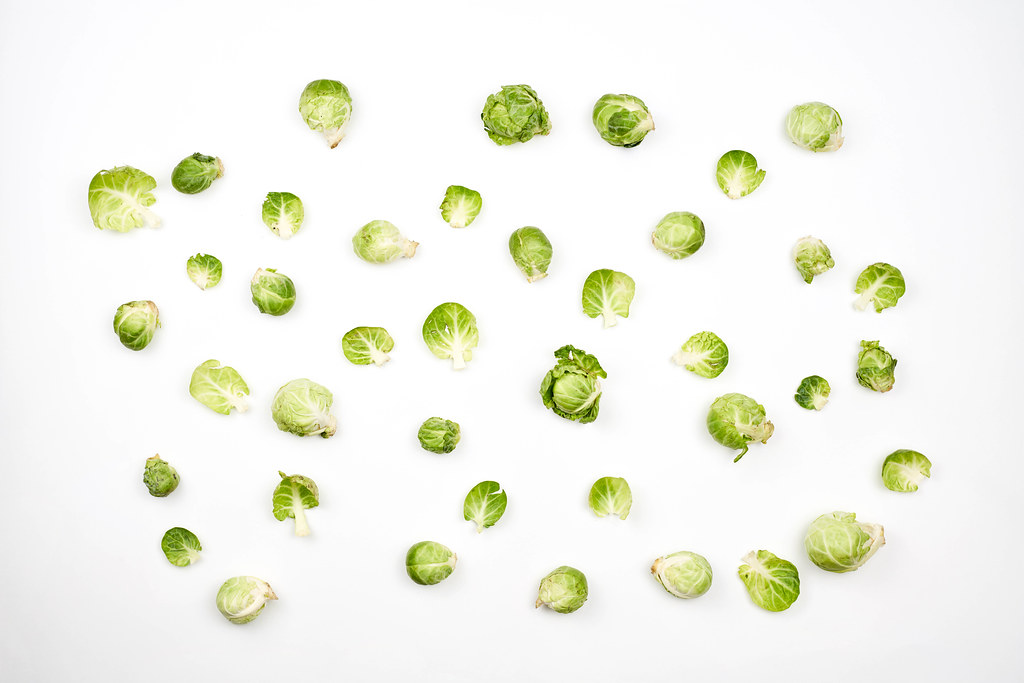 Background of brussels sprouts on white