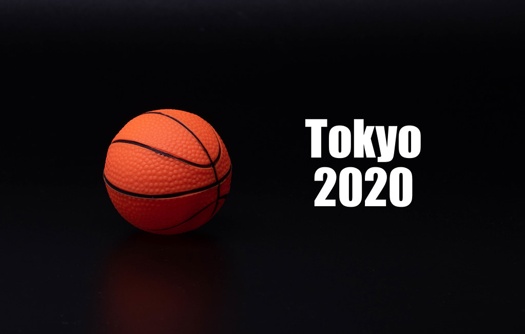 Basketball ball with Tokyo 2020 text on black background
