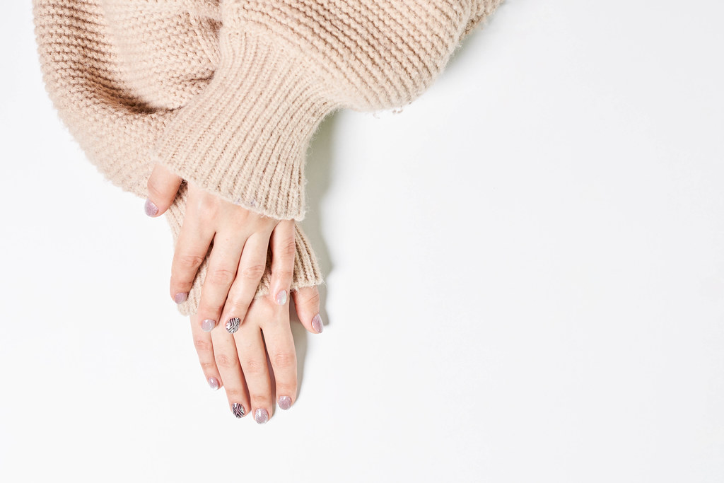 Beautiful female hand with winter manicure