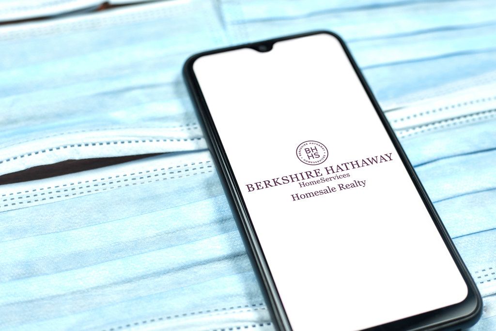 Berkshire Hathaway logo on smartphone screen. Global company during coronavirus crisis