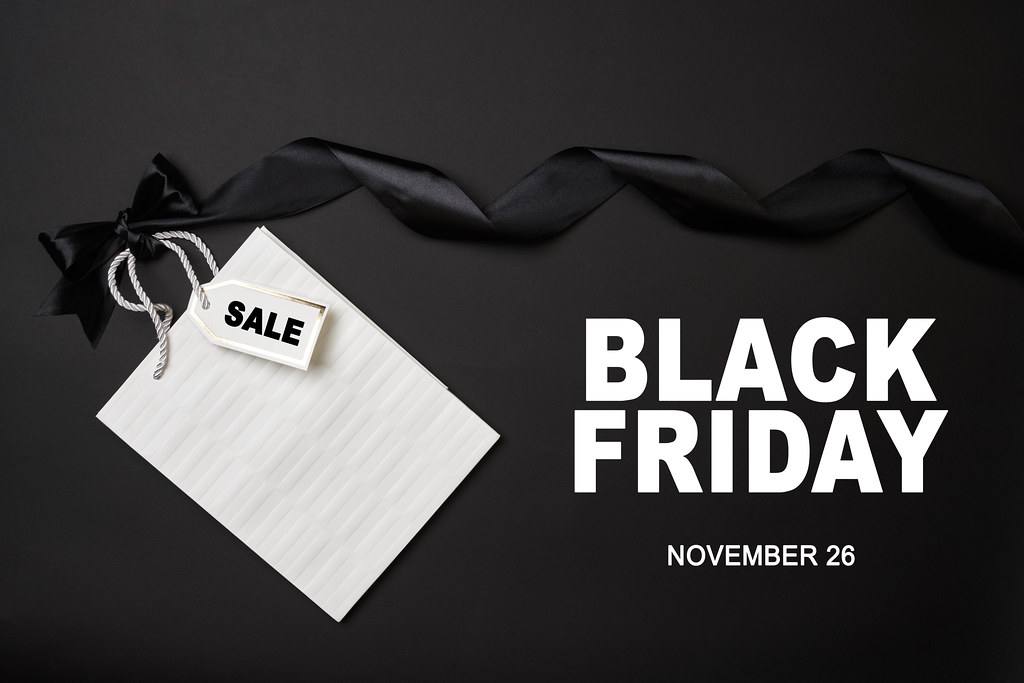Black Friday 2021 - 26 November with white shopping bag and ribbon