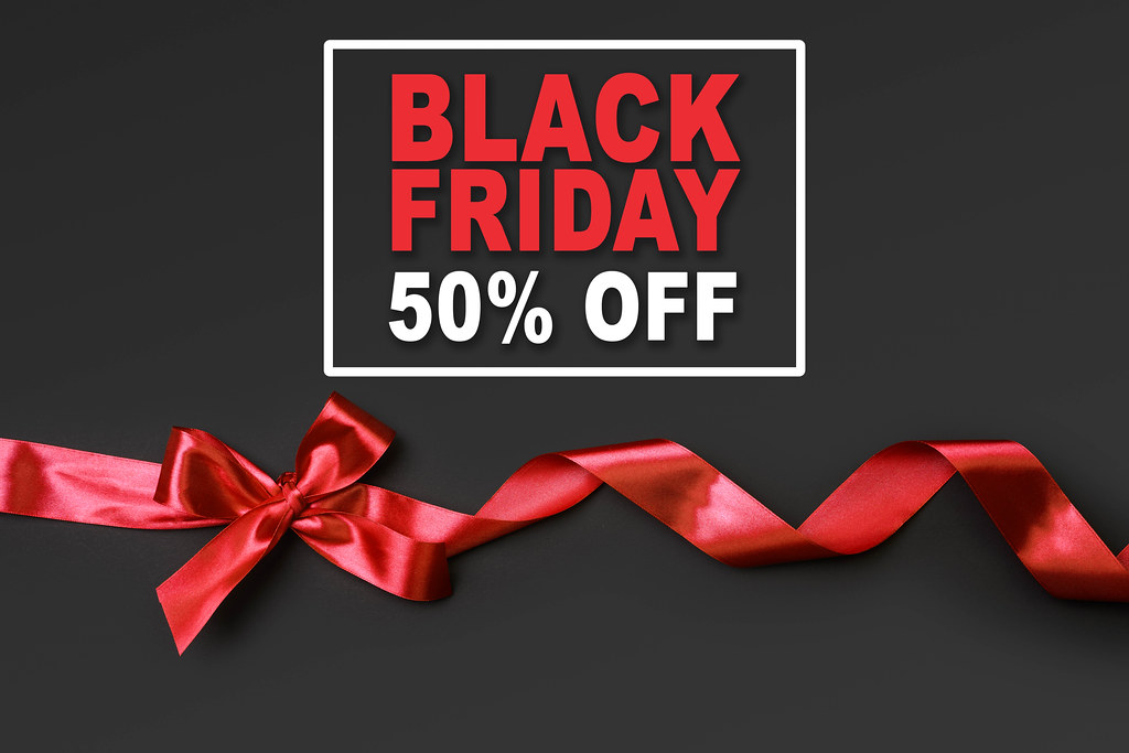 Black Friday banner with 50% off discount sale on black background
