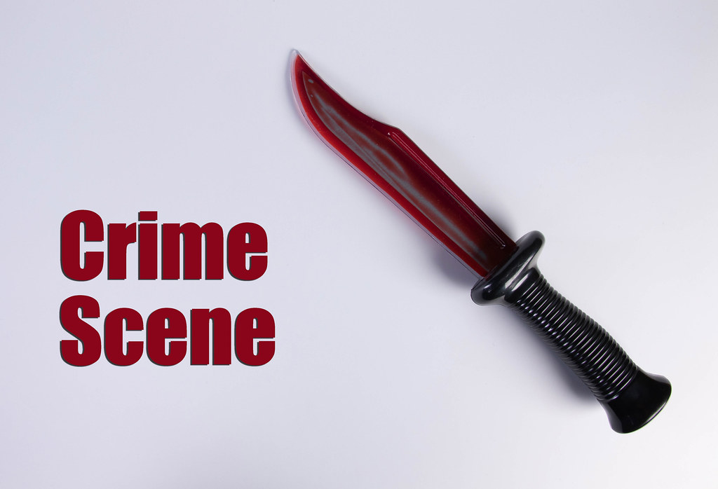 Bloody knife with Crime Scene text