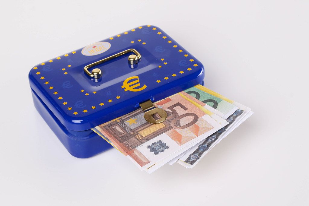 Blue metal cash box with Euro banknotes
