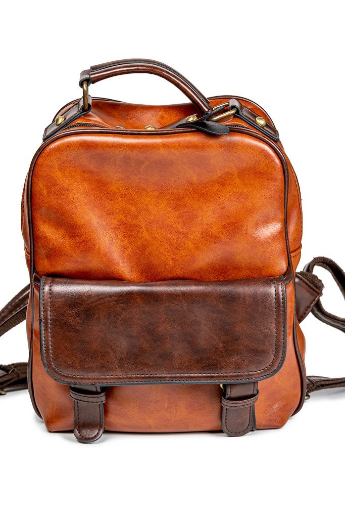 Brown leather backpack on white background