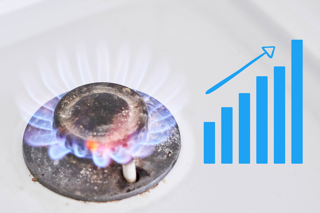 Burning gas stove and rising chart symbol of rising natural gas price