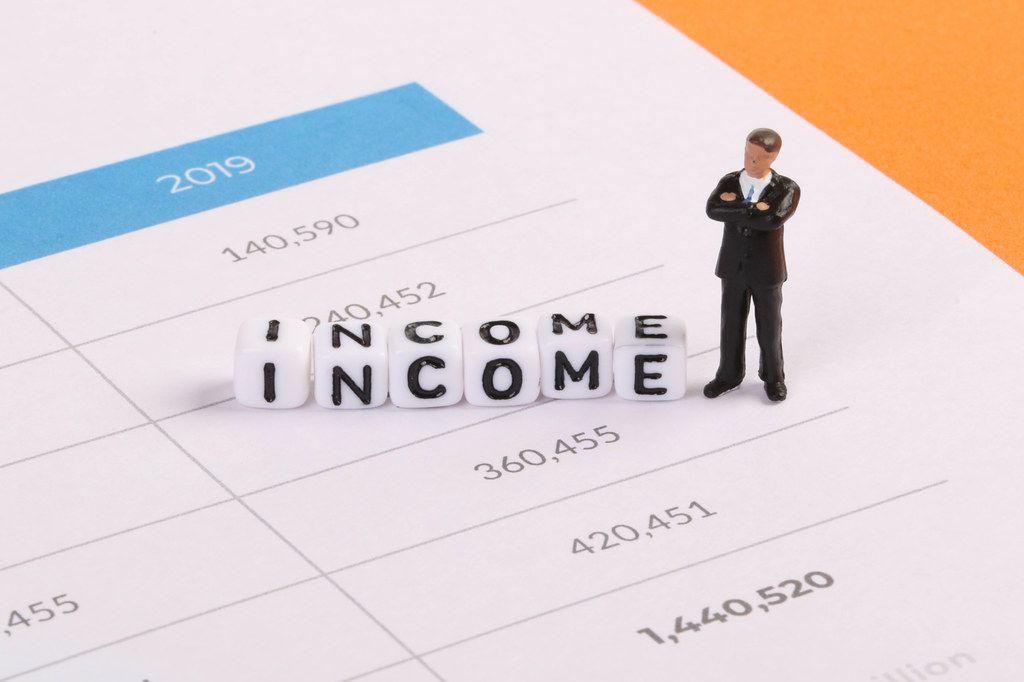 Businessman figure with Income text