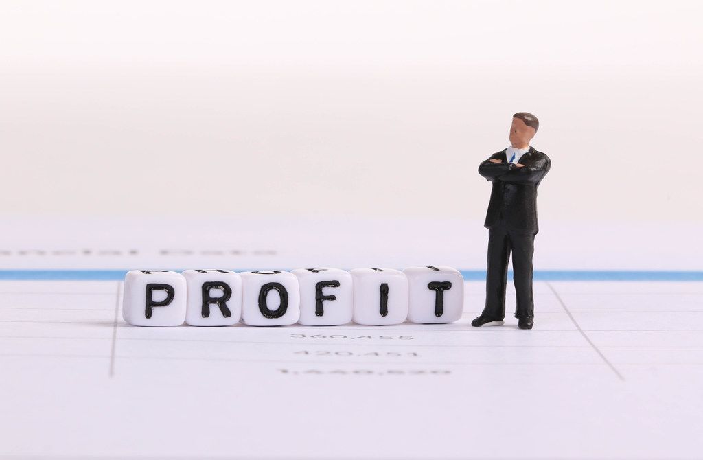 Businessman figure with Profit text