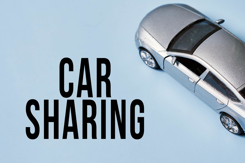 Car sharing concept with gray toy car