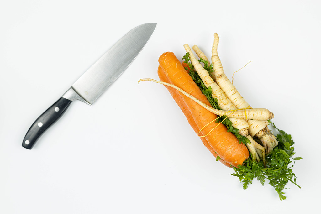 Carrot and Parsnip on the table with knife