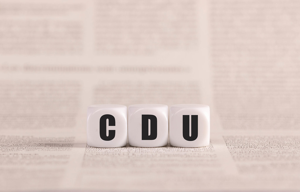 CDU written with cubes on a newspaper