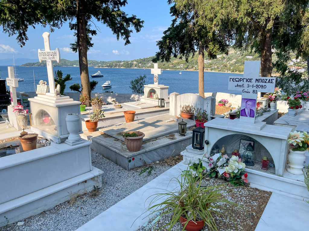 Cemetery on the hill with sea view on Skiathos, with graves of important Greek authors