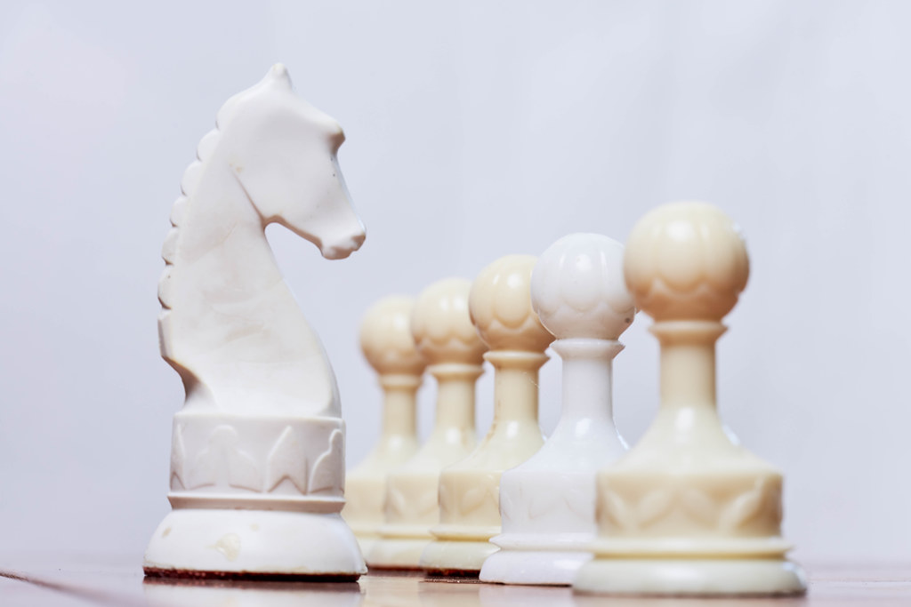 Chess pieces on board for game and strategy