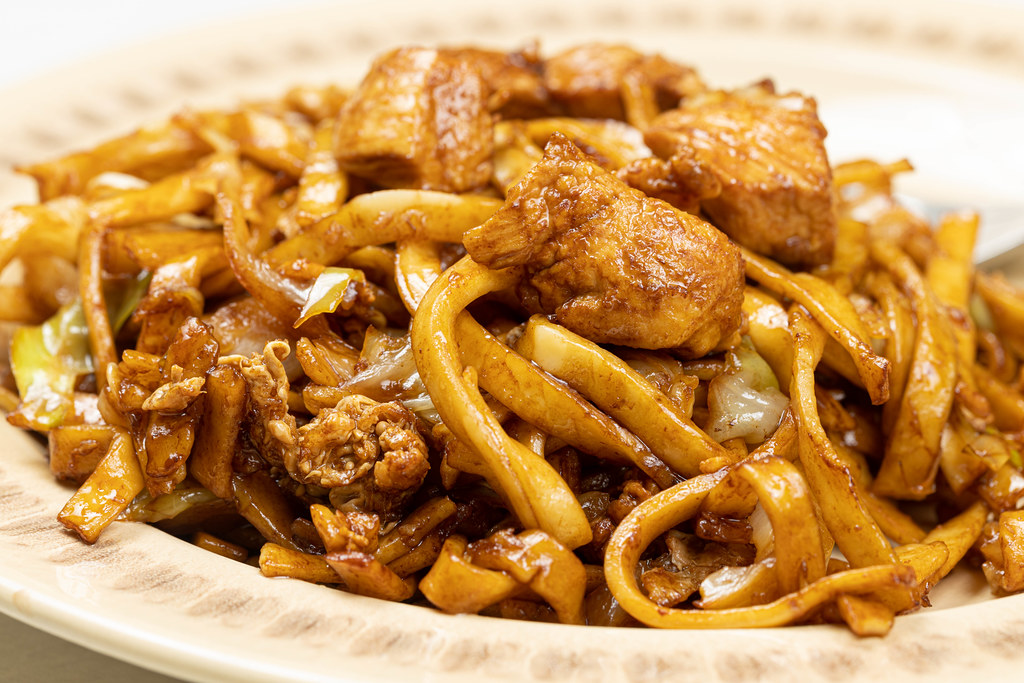 Chinese Food with Spaghetti and Chicken Meat served on the plate