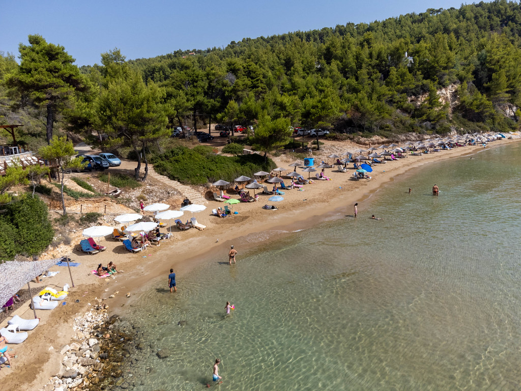 Chrisi Milia: the only small sandy beach on Alonissos. Narrow beach with two rows of parasols