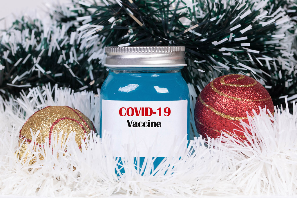 Christmas ornaments and Covid-19 vaccine bottle