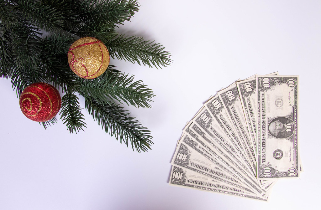 Christmas ornaments and dollar banknotes