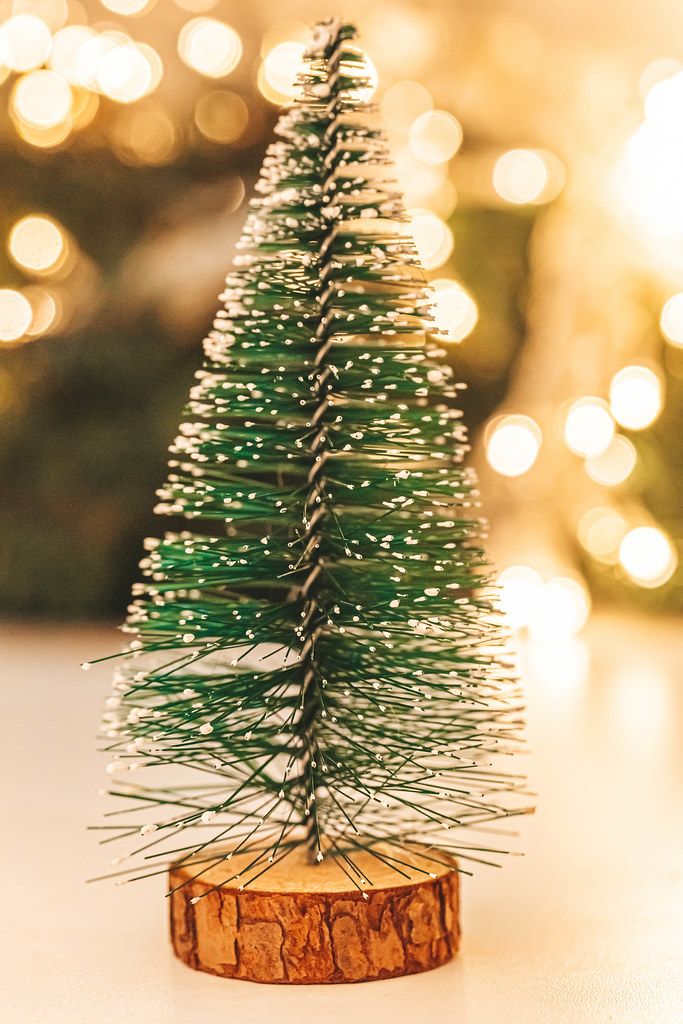 Christmas tree on a background of golden bokeh