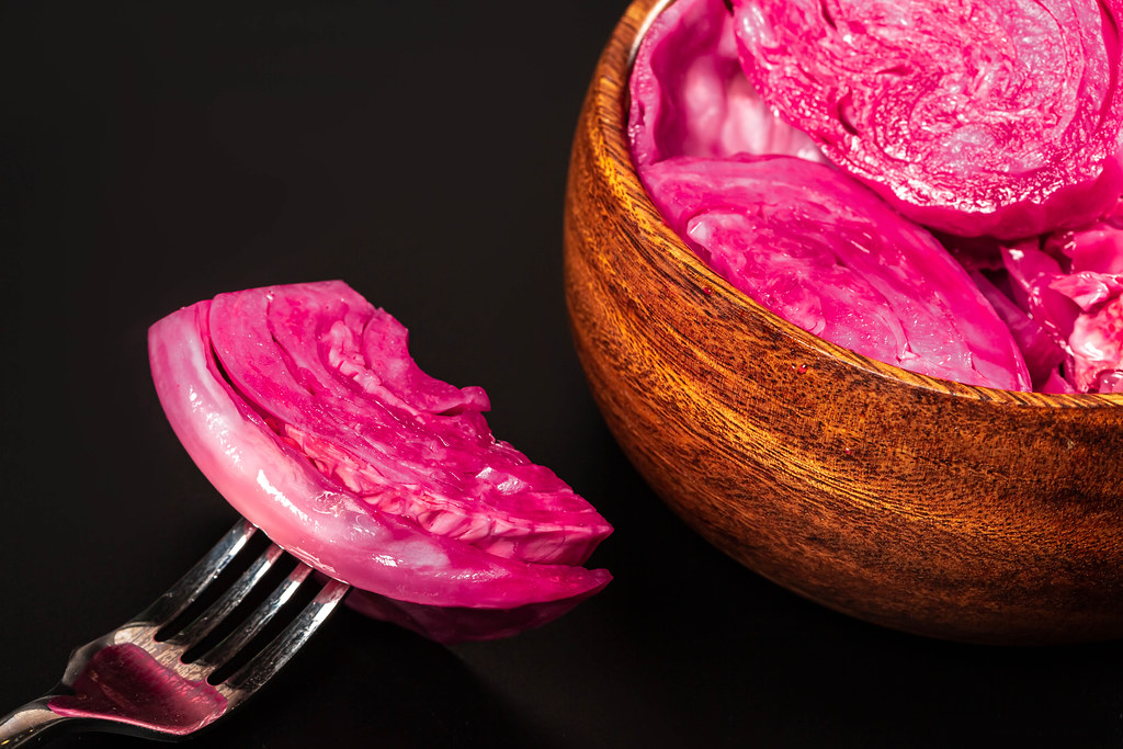 Close-up, a piece of pickled cabbage on a fork