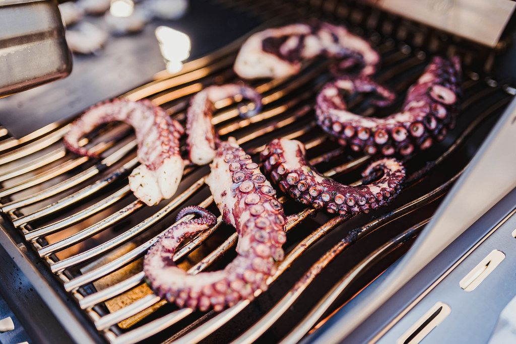 Close Up Of Grilled Octopus Legs On The Grill