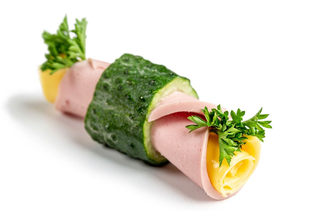 Close-up, roll with cucumber, sausage, cheese, tomatoes and parsley