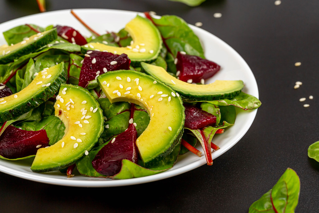 Close-up, salad with boiled beetroot, beet leaves and avocado