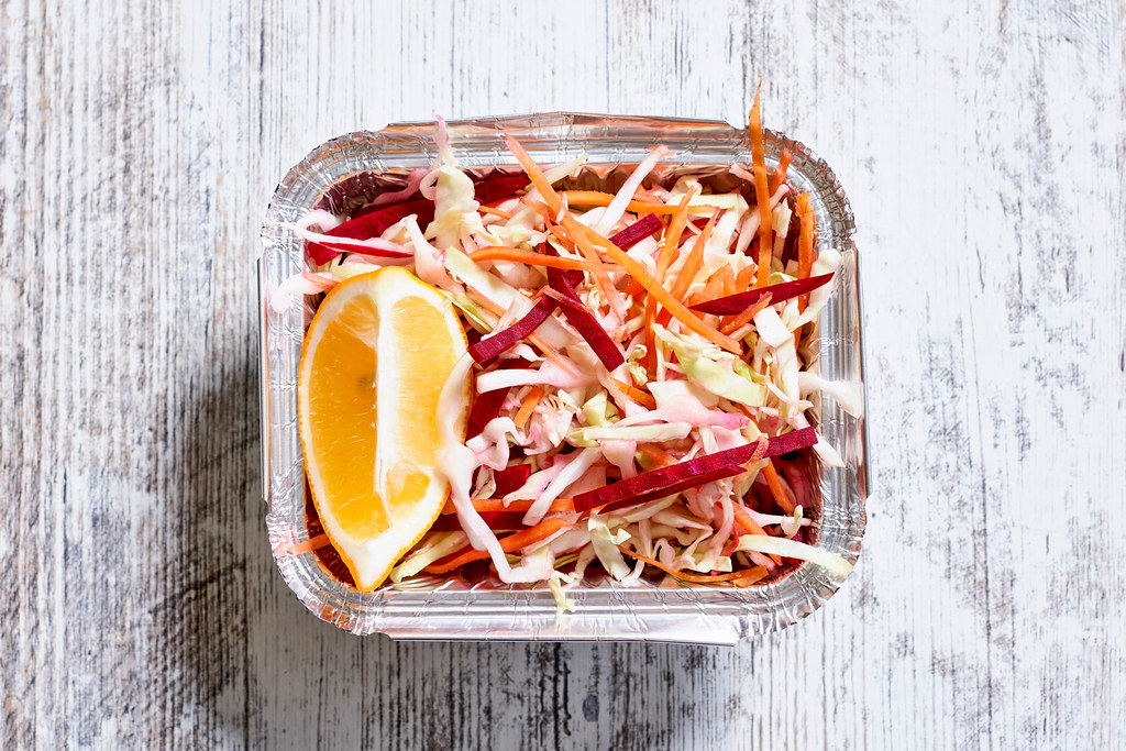 Close-up shot of beetroot and cabbage based dieting salad with a slice of lemon