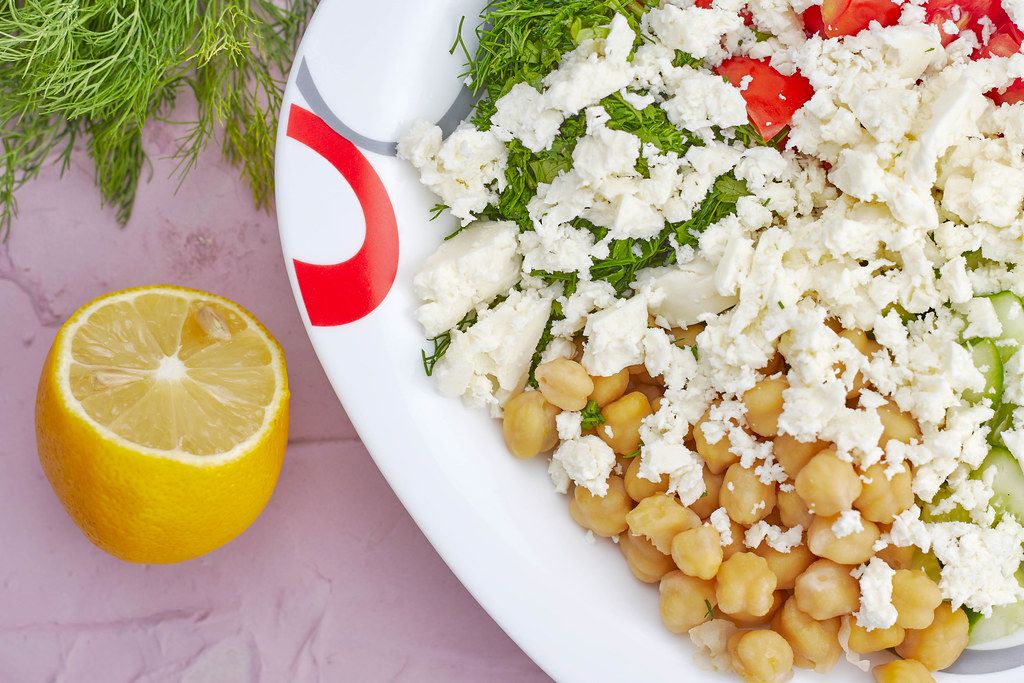 Close-up shot of delicious greek chickpea salad on plate
