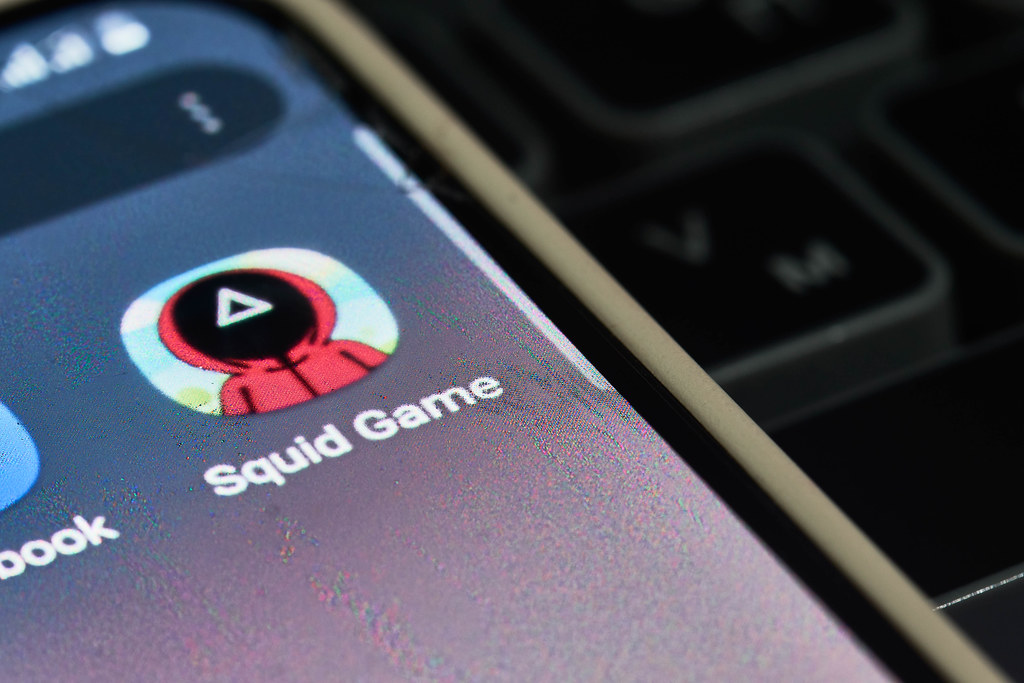 Close-up view of new Netflix show - Squid game application icon on smartphone screen