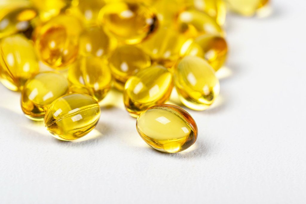 Close-up, yellow vitamin A capsules